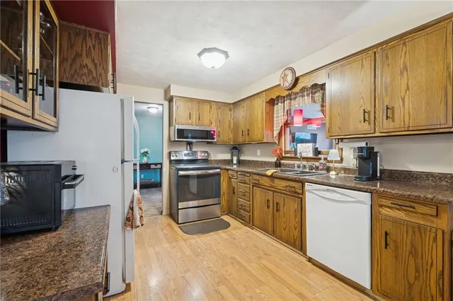 a kitchen with a sink stove and refrigerator