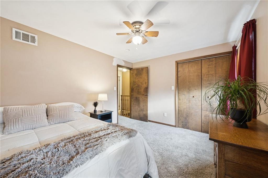 603 Forbes Trail Road Greensburg, PA 15601 - Photo 31 of 38 a bedroom with a bed a window and a potted plant