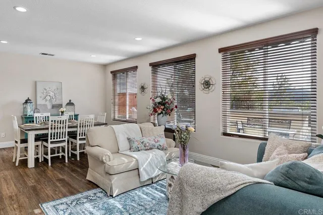 a living room with furniture and windows