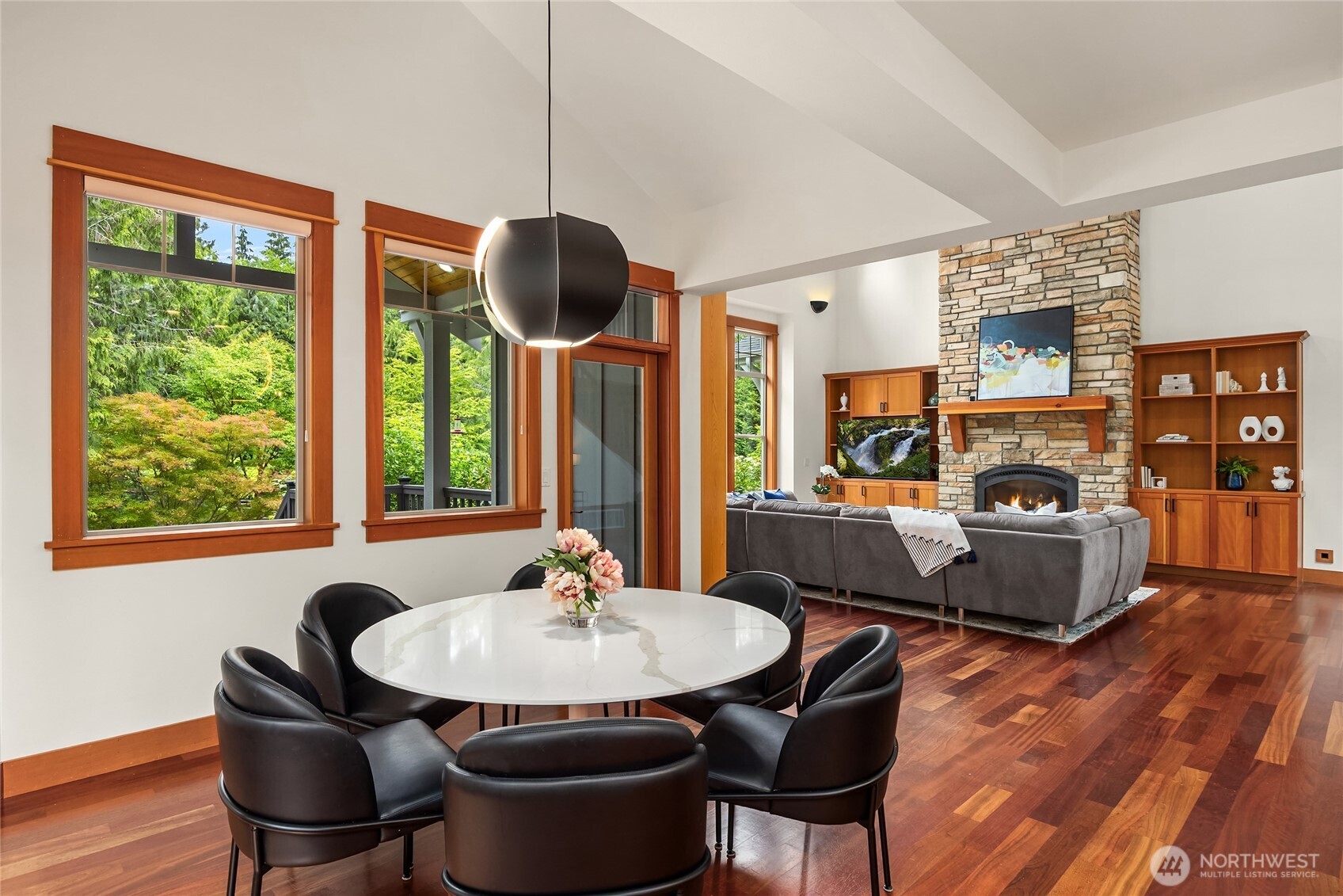 6477 Haley Loop Road Northeast Bainbridge Island, WA 98110 - Photo 13 of 40 a dining room with furniture a window and wooden floor