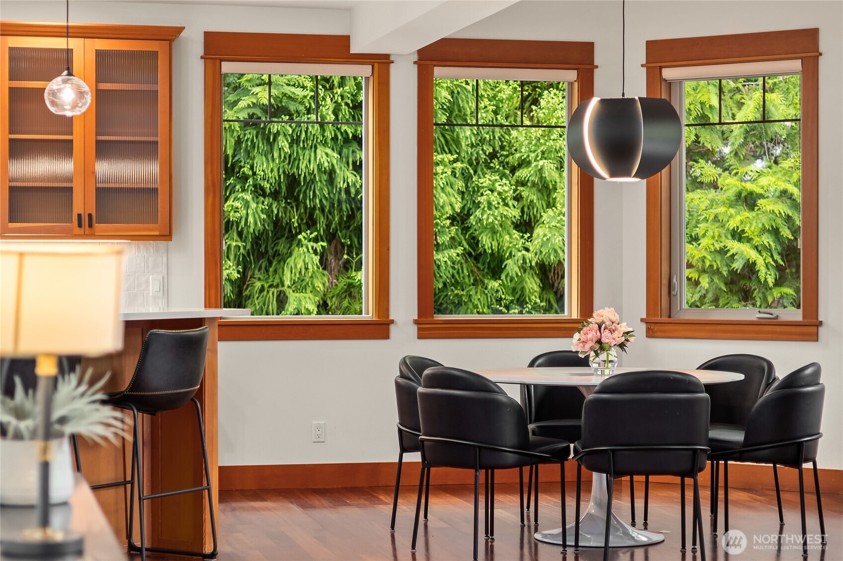 6477 Haley Loop Road Northeast Bainbridge Island, WA 98110 - Photo 14 of 40 a view of a dining room with furniture and windows