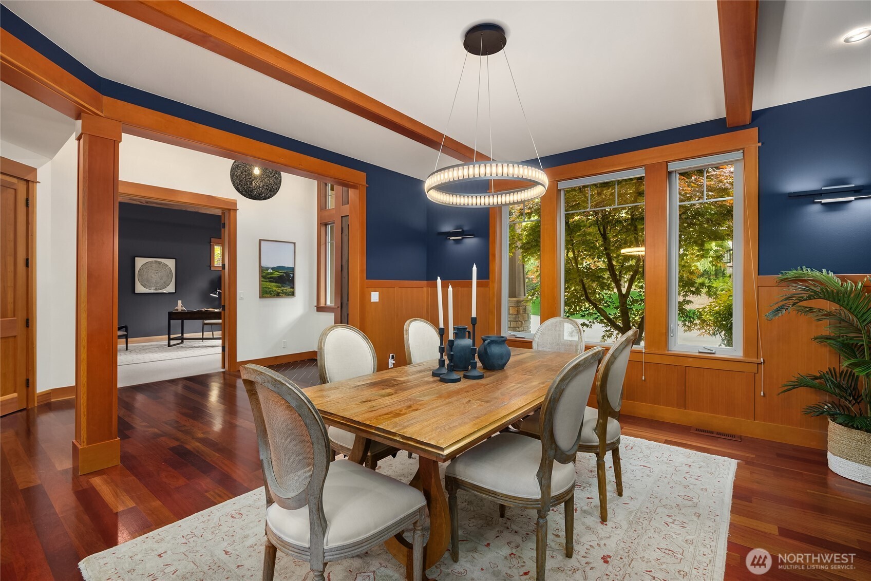 6477 Haley Loop Road Northeast Bainbridge Island, WA 98110 - Photo 17 of 40 a view of a dining room with furniture window and wooden floor