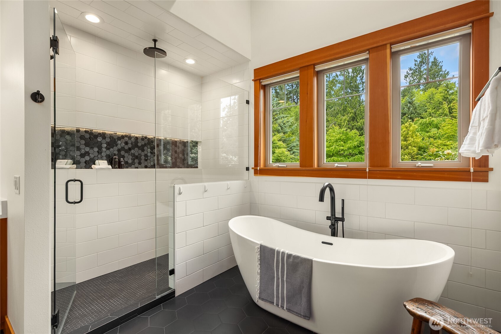 6477 Haley Loop Road Northeast Bainbridge Island, WA 98110 - Photo 24 of 40 a bathroom with a bathtub and a sink
