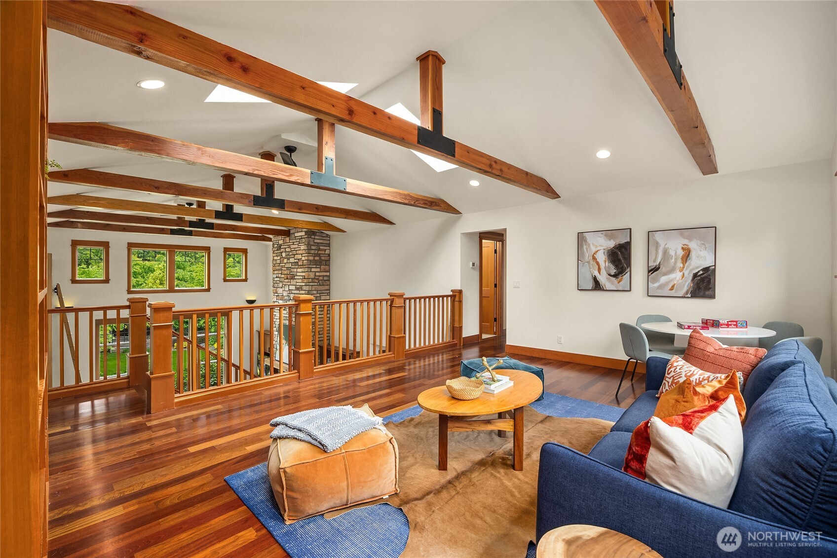 6477 Haley Loop Road Northeast Bainbridge Island, WA 98110 - Photo 25 of 40 a living room with furniture kitchen view and a wooden floor