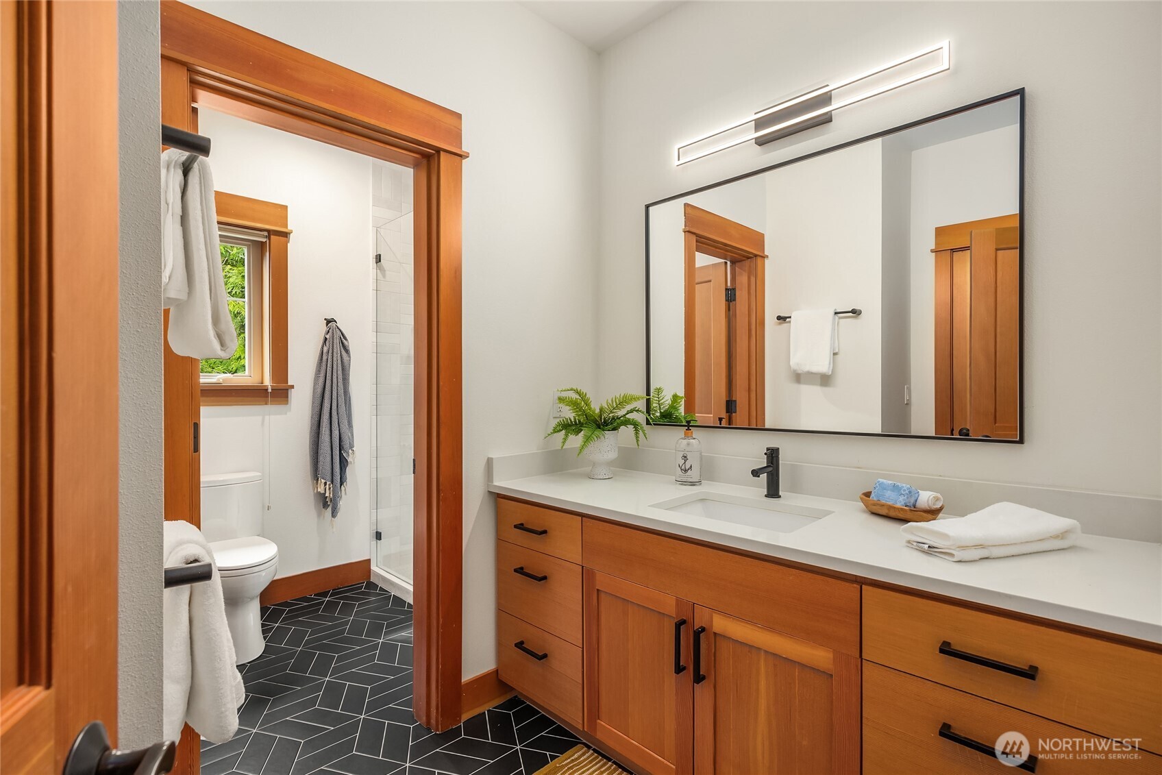 6477 Haley Loop Road Northeast Bainbridge Island, WA 98110 - Photo 31 of 40 a bathroom with a sink and a mirror