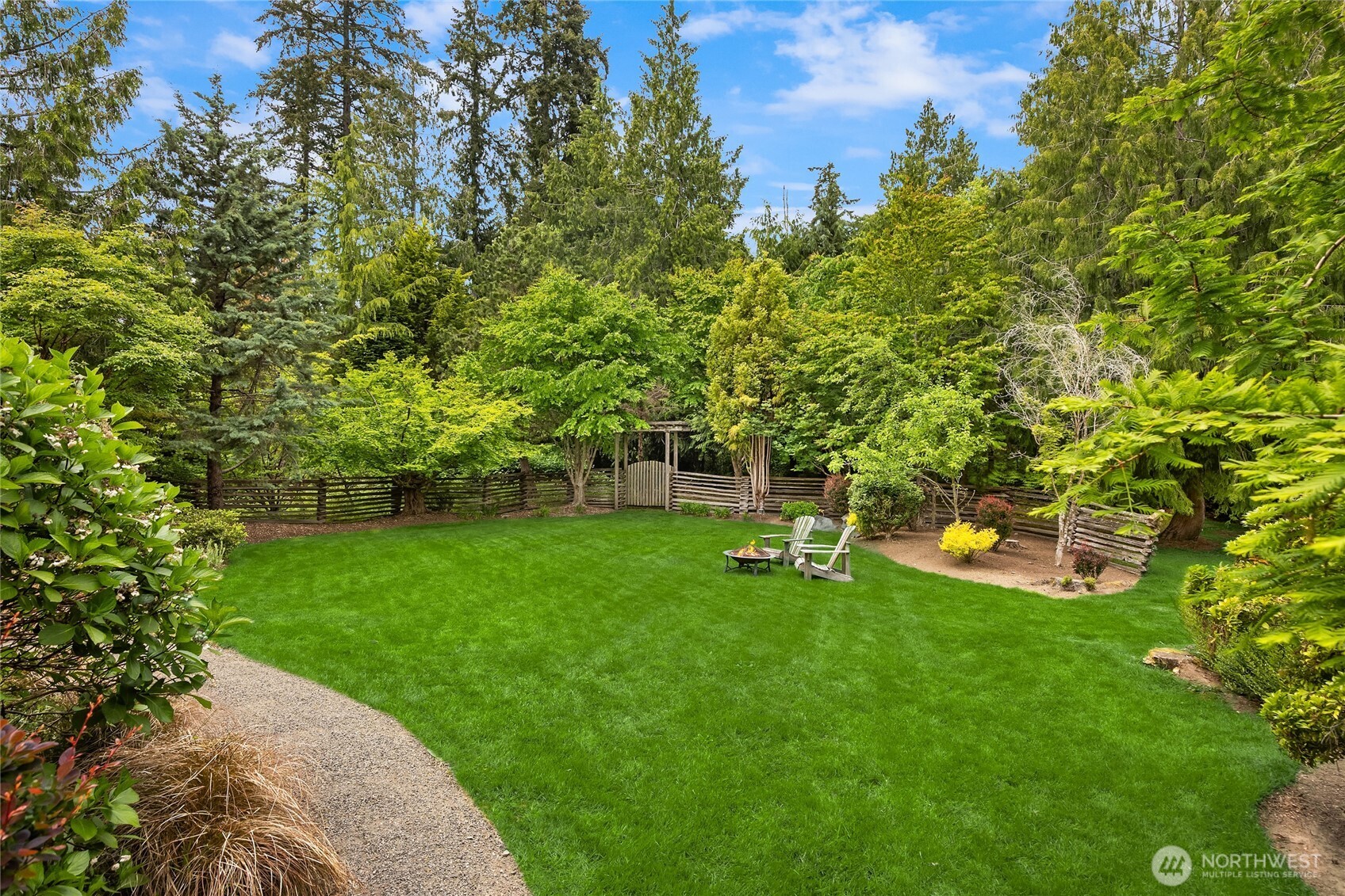 6477 Haley Loop Road Northeast Bainbridge Island, WA 98110 - Photo 34 of 40 a view of a chair and table of the garden
