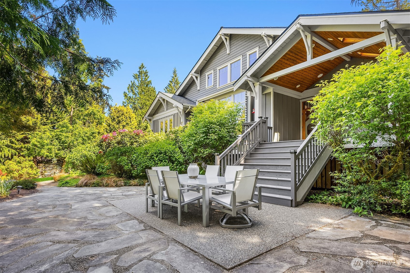 6477 Haley Loop Road Northeast Bainbridge Island, WA 98110 - Photo 36 of 40 a view of a patio with table and chairs and potted plants