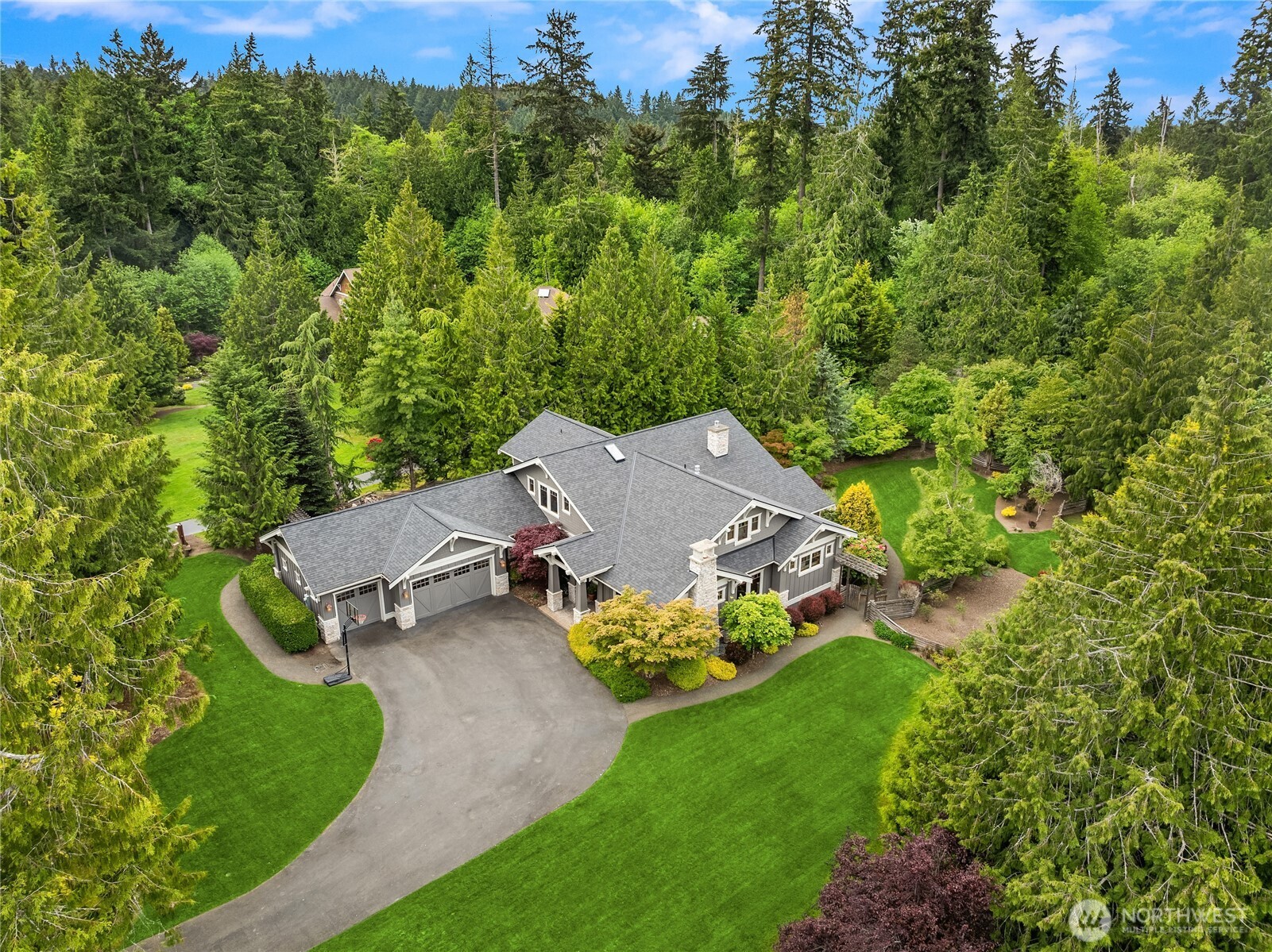 6477 Haley Loop Road Northeast Bainbridge Island, WA 98110 - Photo 39 of 40 an aerial view of a house with a yard