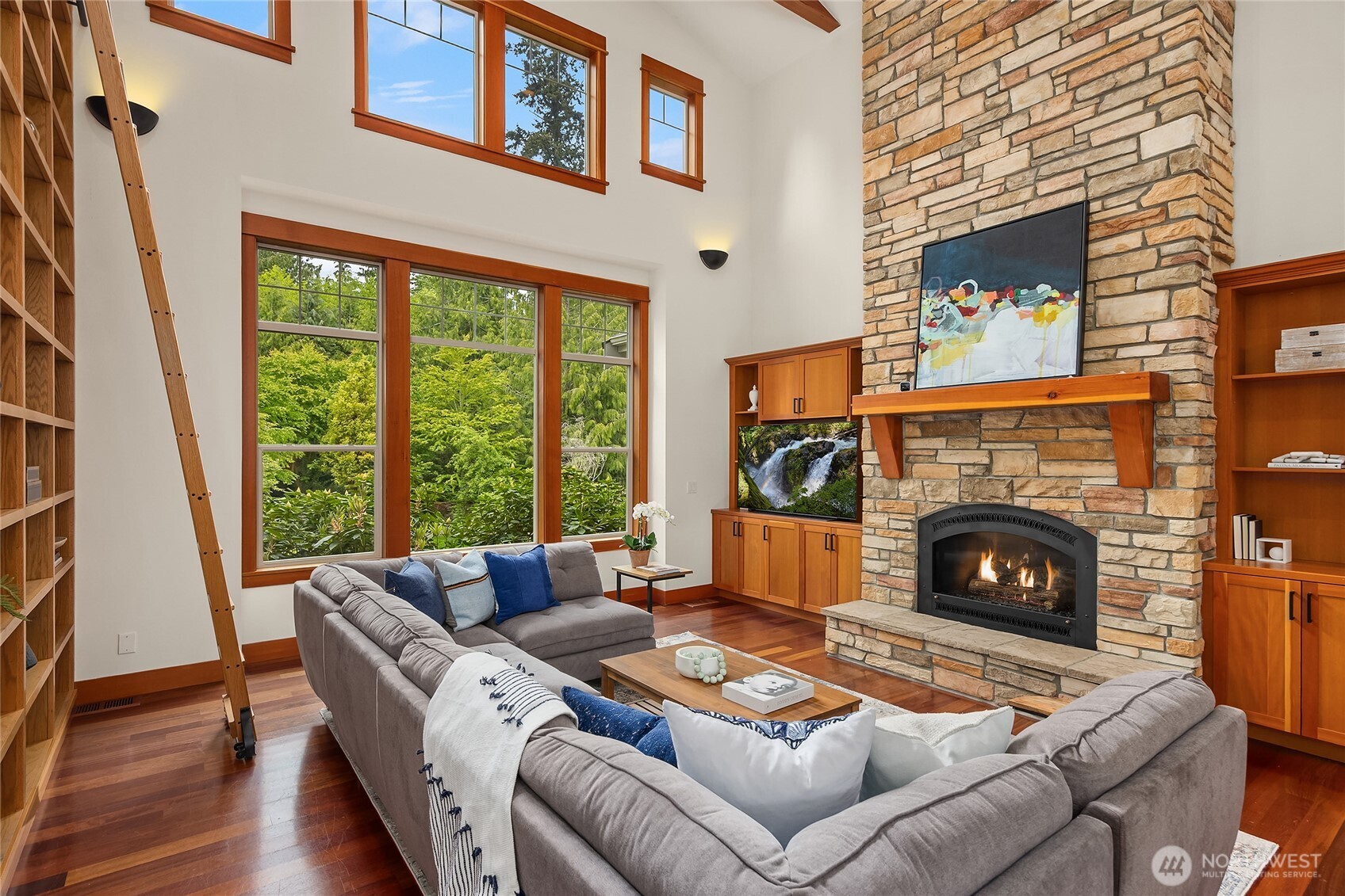 6477 Haley Loop Road Northeast Bainbridge Island, WA 98110 - Photo 5 of 40 a living room with furniture and a fireplace