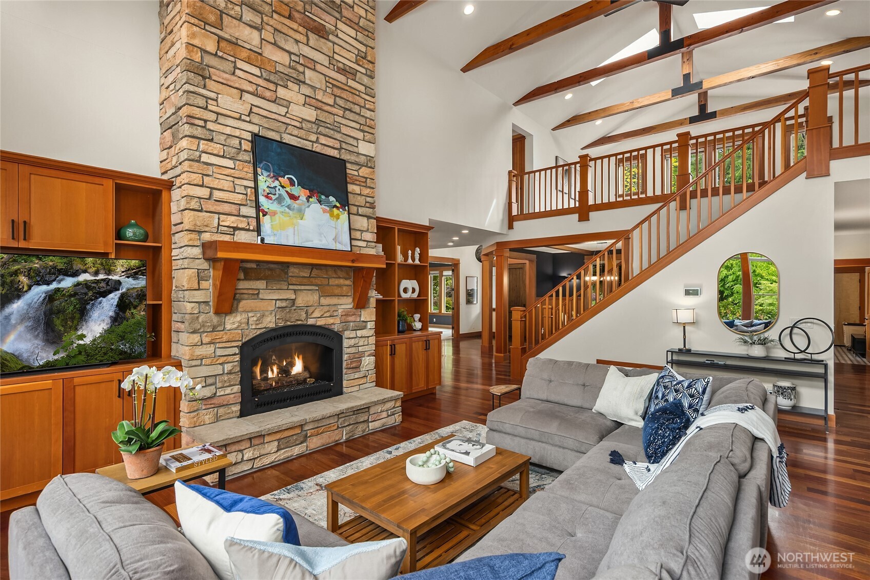 6477 Haley Loop Road Northeast Bainbridge Island, WA 98110 - Photo 7 of 40 a living room with furniture and a fireplace