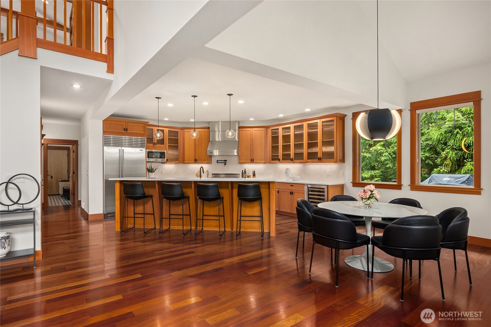 6477 Haley Loop Road Northeast Bainbridge Island, WA 98110 - Photo 9 of 40 a dining room with furniture window and wooden floor