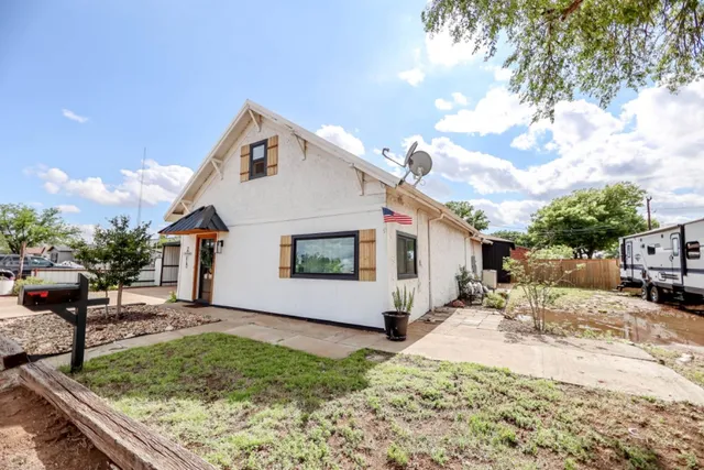 a front view of a house with yard and seating area