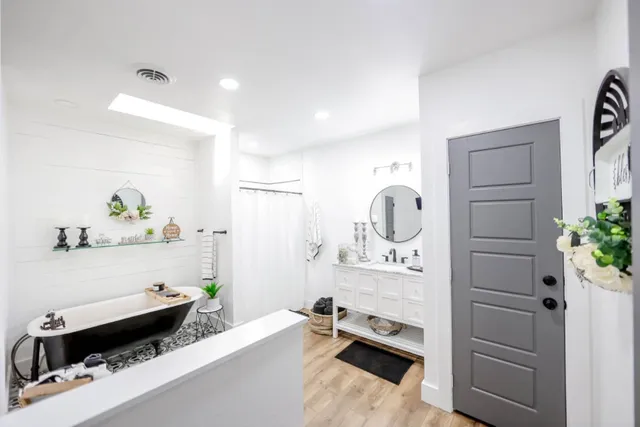 a bedroom with a bed and a dresser