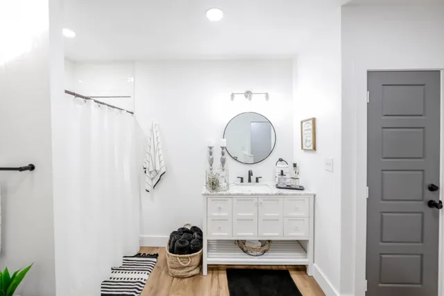 a room with a chair and cabinets