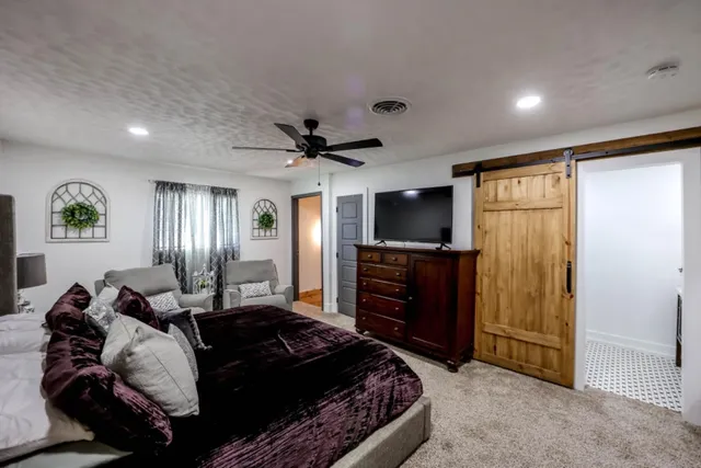 a bathroom with a sink mirror vanity and toilet