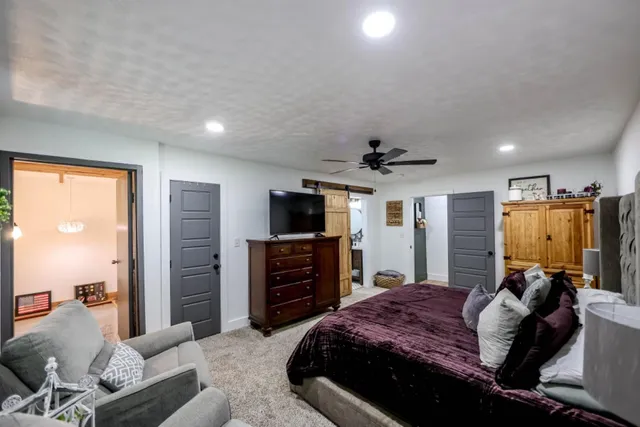 a view of a hallway with wooden floor and entryway