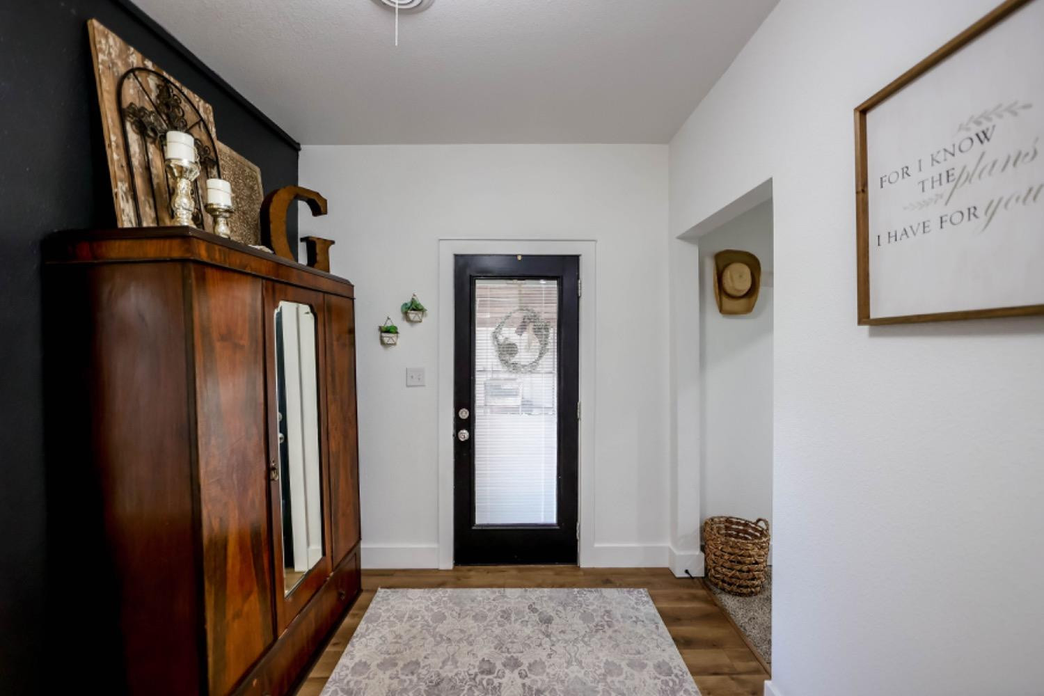 209 D Avenue Abernathy, TX 79311 - Photo 35 of 43 a view of an entryway with wooden floor