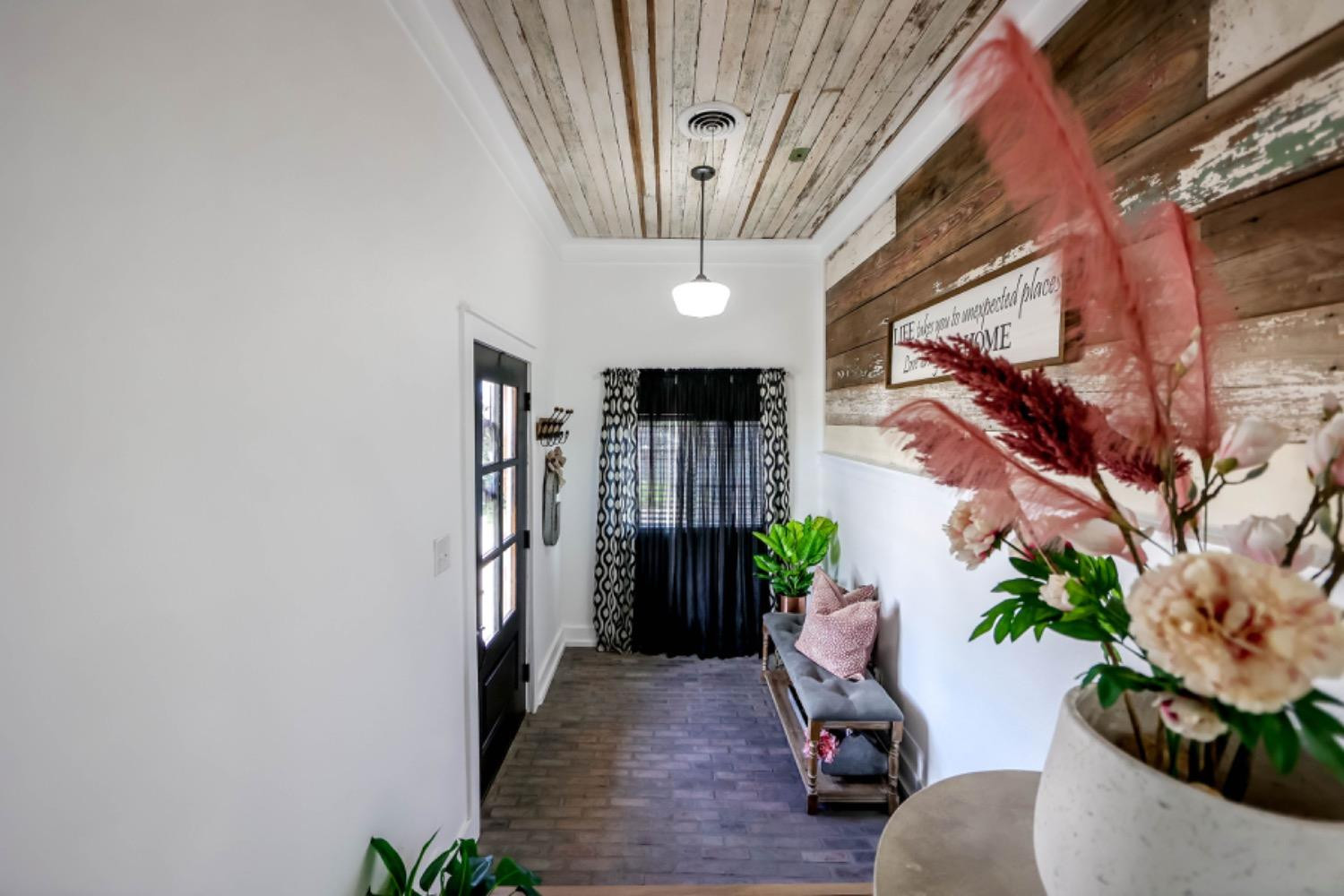 209 D Avenue Abernathy, TX 79311 - Photo 5 of 43 a living room with furniture and a chandelier