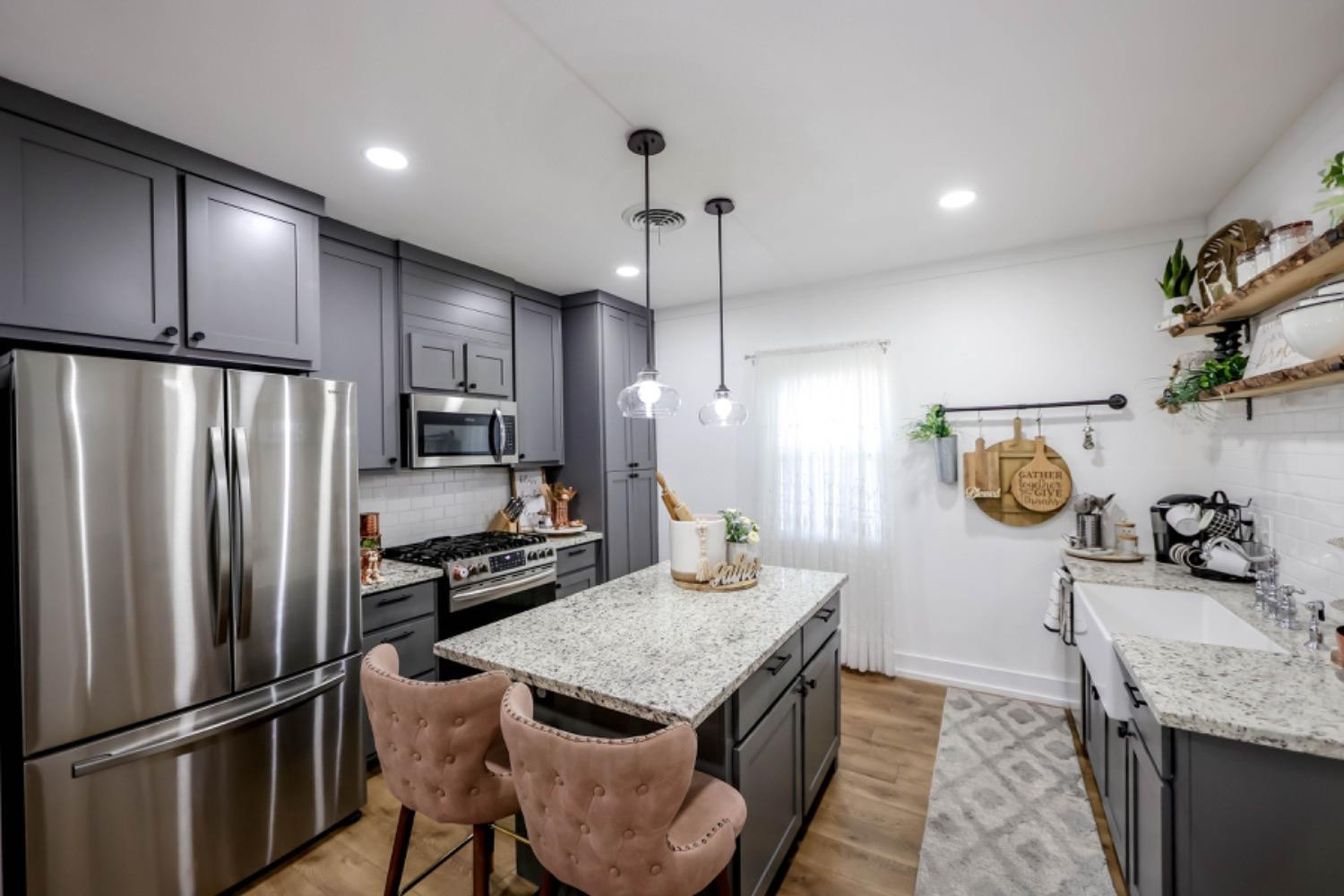 209 D Avenue Abernathy, TX 79311 - Photo 9 of 43 a kitchen with kitchen island a counter top space stainless steel appliances and cabinets