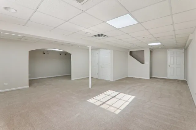 a view of an empty room and a window