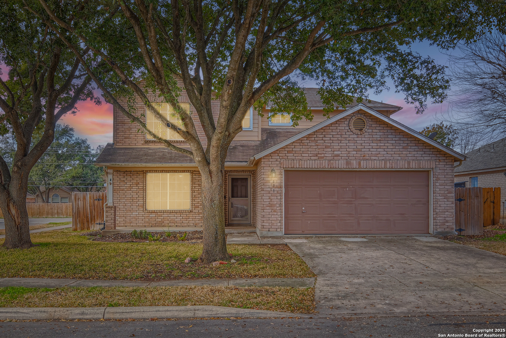 431 Woodstone Loop Cibolo, TX 78108 - Photo 1 of 29 a front view of a house with a yard and garage