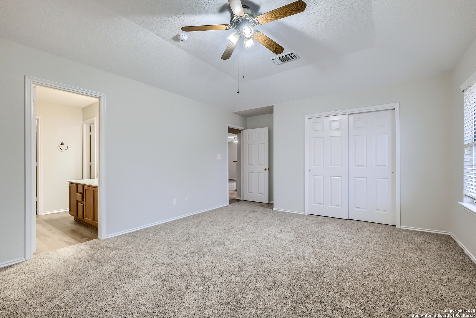 431 Woodstone Loop Cibolo, TX 78108 - Photo 12 of 29 a view of an empty room and a ceiling fan