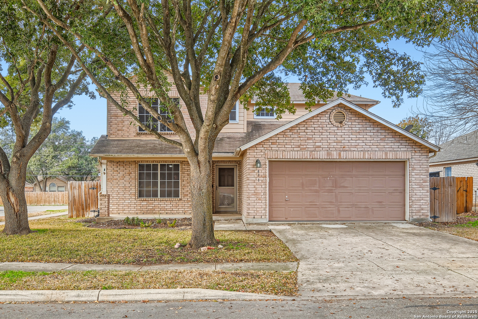 431 Woodstone Loop Cibolo, TX 78108 - Photo 3 of 29 a front view of a house with a yard and garage