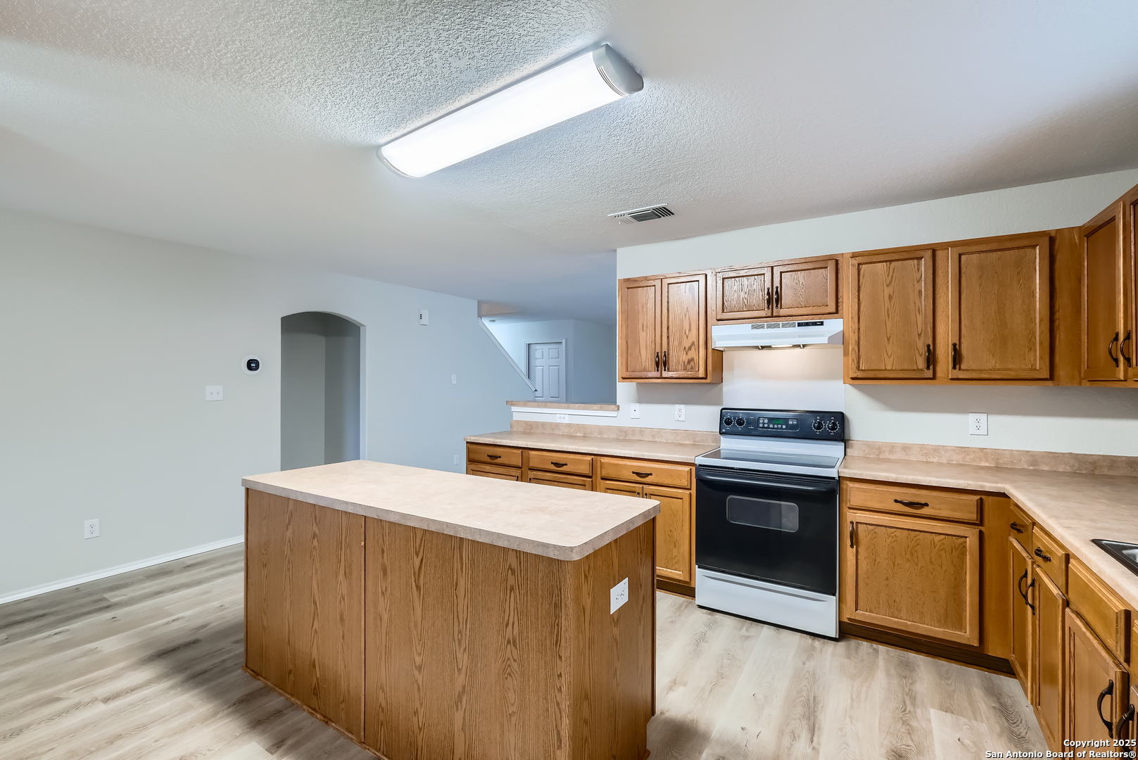 431 Woodstone Loop Cibolo, TX 78108 - Photo 6 of 29 a kitchen with stainless steel appliances granite countertop a stove a sink dishwasher and a refrigerator