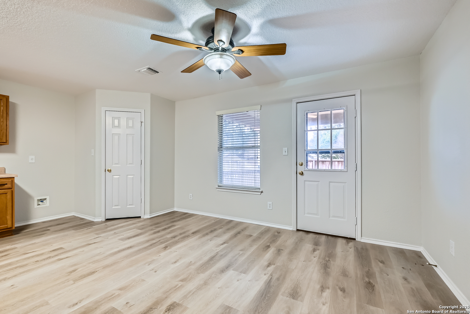 431 Woodstone Loop Cibolo, TX 78108 - Photo 10 of 29 an empty room with wooden floor closet and windows