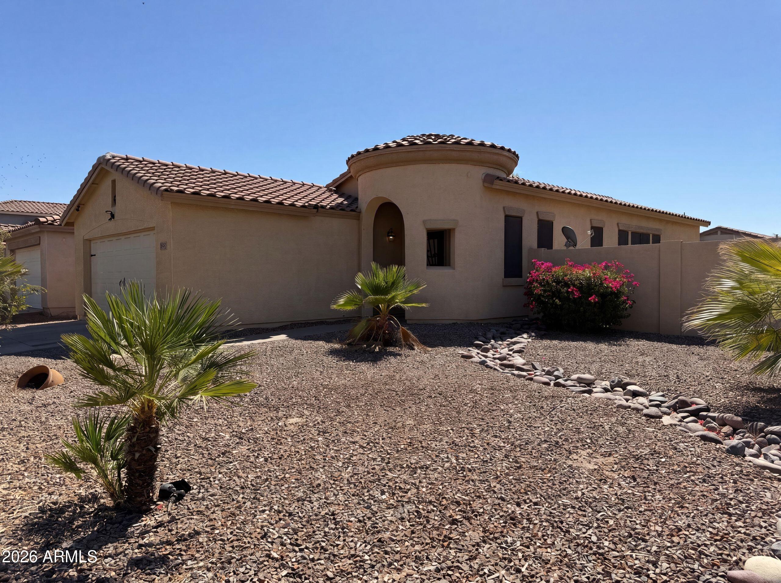 3951 East Timberline Road Gilbert, AZ 85297 - Photo 24 of 28 a front view of a house with a yard