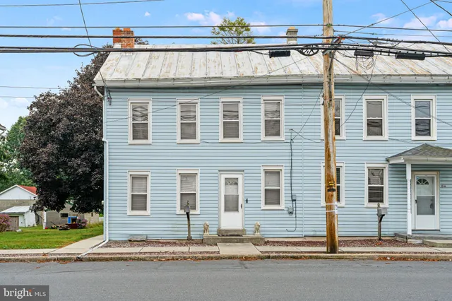 a front view of a house with a garage