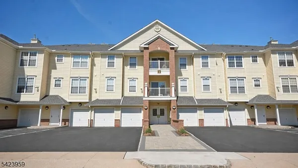 a front view of a building with a lot of windows
