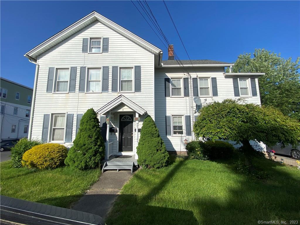 3 Geddes Terrace Waterbury, CT 06708 - Photo 1 of 1 a front view of a house with a yard