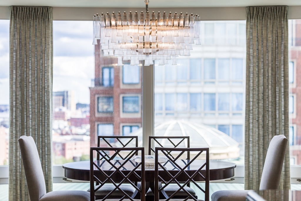 10 Rowes Wharf, Unit PH4 Boston, MA 02110 - Photo 14 of 42 a view of a dining room with furniture and a window