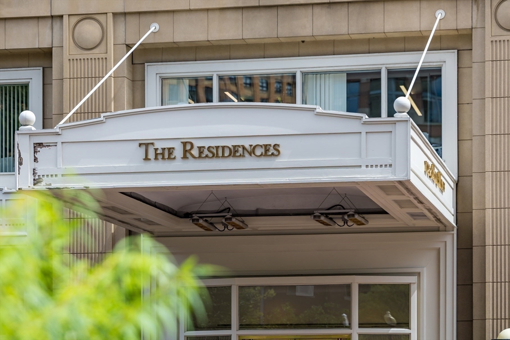10 Rowes Wharf, Unit PH4 Boston, MA 02110 - Photo 5 of 42 a sign that is on the side of a building