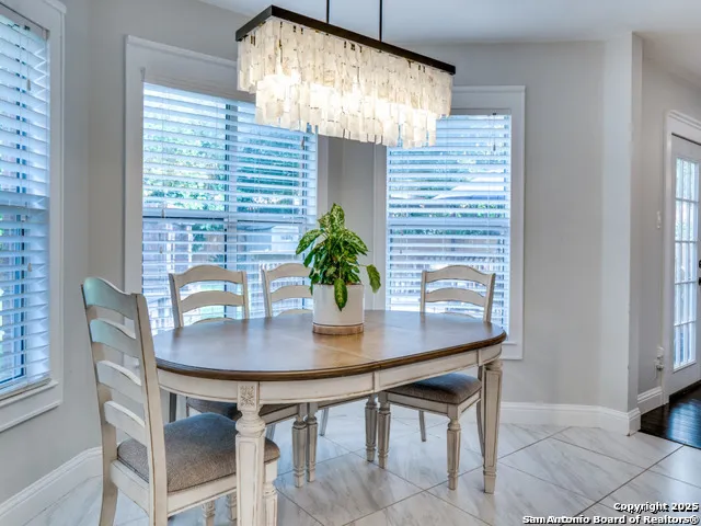 a view of a dining room with furniture window and outside view