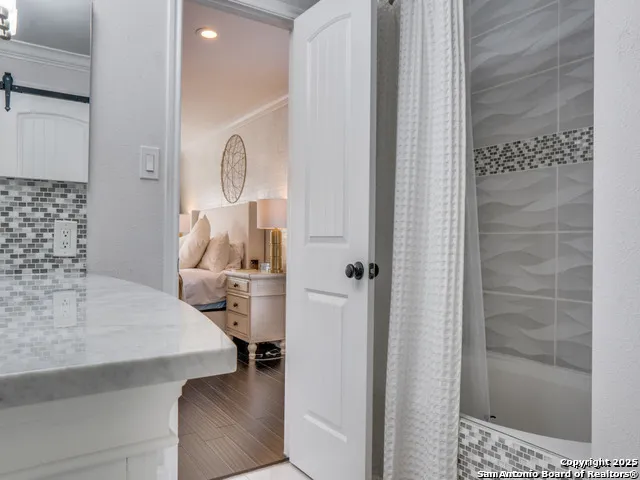 a room with a sink and cabinets