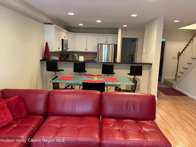 a living room with a couch and a dresser