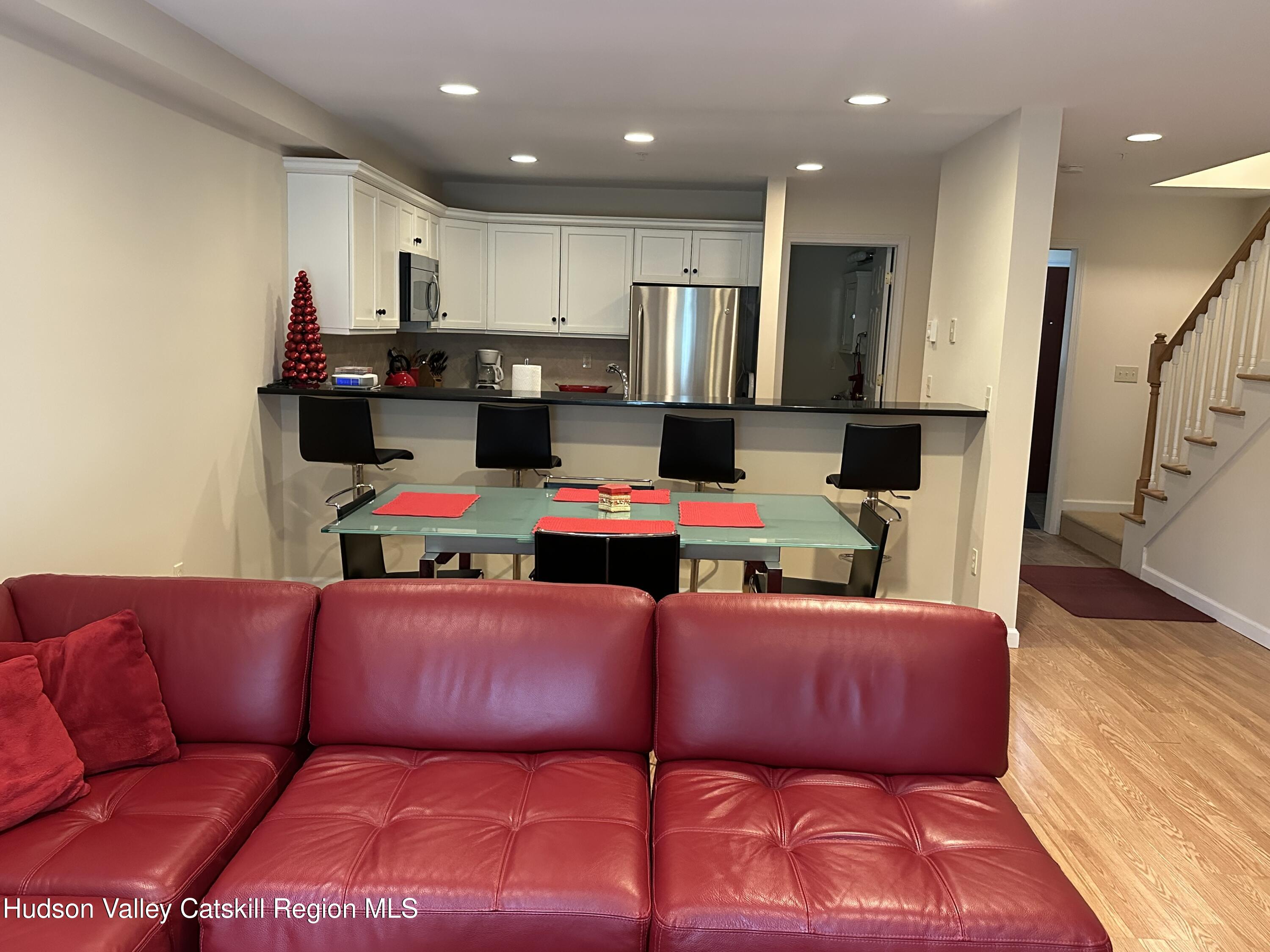 274 Brooksburgh Road, Unit 67 Hensonville, NY 12439 - Photo 11 of 36 a bedroom with a bed and a view of kitchen