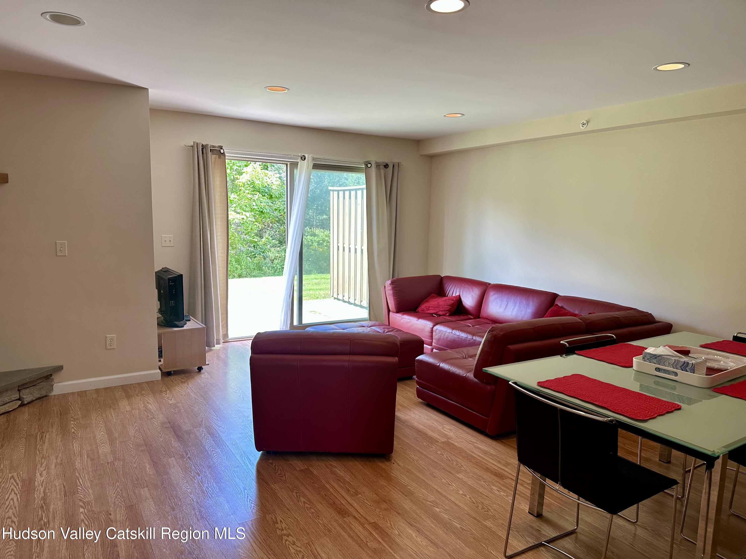 274 Brooksburgh Road, Unit 67 Hensonville, NY 12439 - Photo 12 of 36 a living room with a couch and a dresser