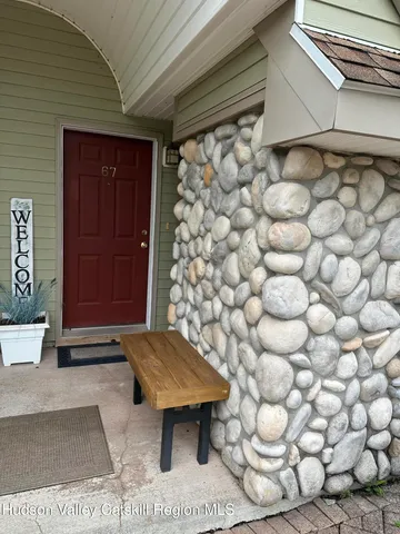 a view of a wooden door and chair