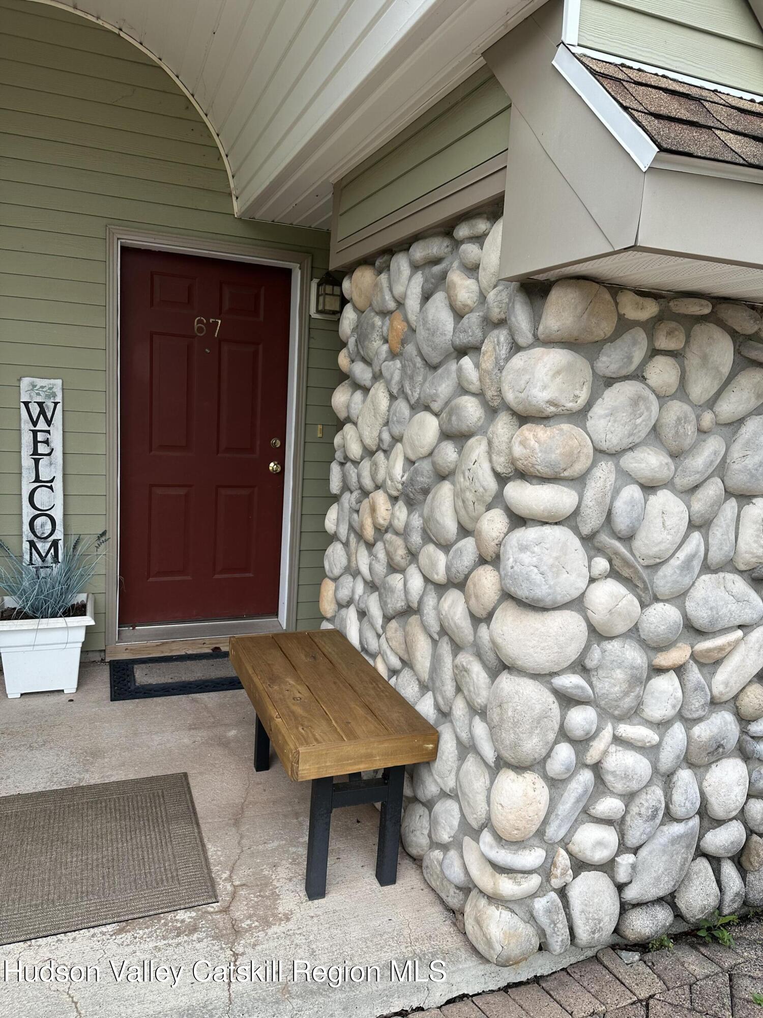 274 Brooksburgh Road, Unit 67 Hensonville, NY 12439 - Photo 2 of 36 a view of a wooden door and chair