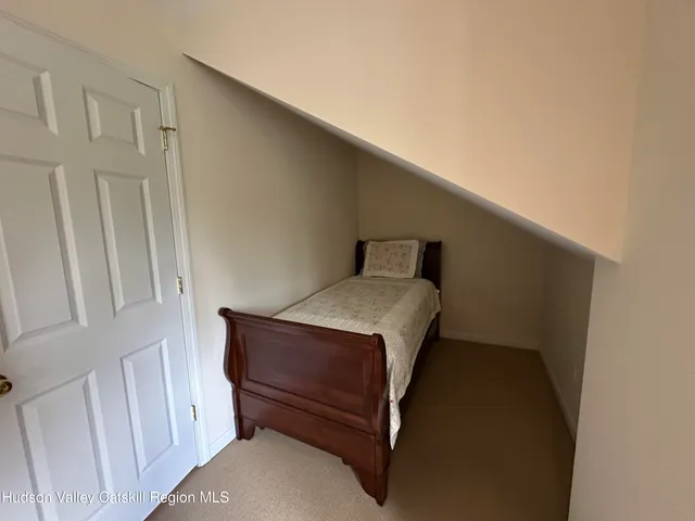 a bathroom with a sink mirror vanity and toilet