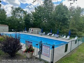 274 Brooksburgh Road, Unit 67 Hensonville, NY 12439 - Photo 34 of 36 a view of a backyard with sitting area and tub