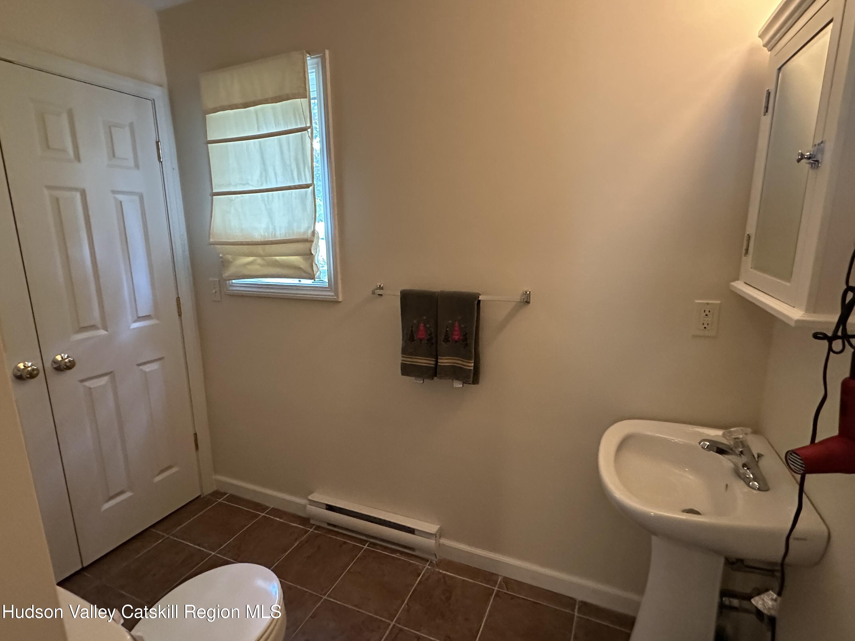 274 Brooksburgh Road, Unit 67 Hensonville, NY 12439 - Photo 4 of 36 a bathroom with a sink toilet and shower