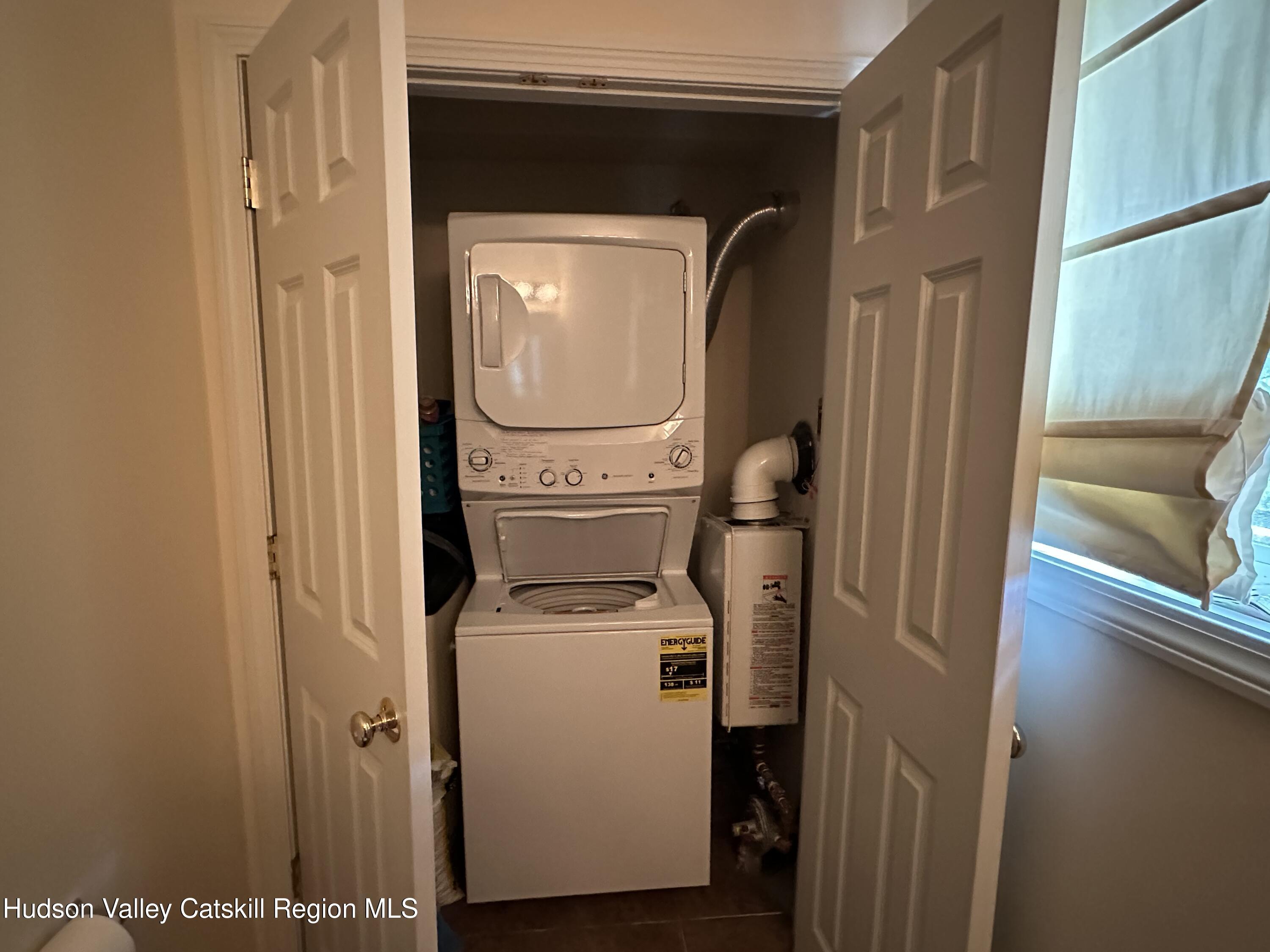 274 Brooksburgh Road, Unit 67 Hensonville, NY 12439 - Photo 5 of 36 a utility room with dryer and washer