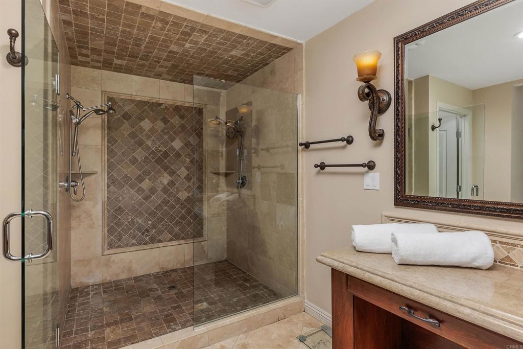 16346 Via Del Alba Rancho Santa Fe, CA 92067 - Photo 18 of 34 a bathroom with a shower and a sink