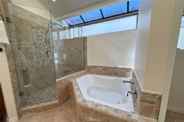 a bathroom with a bathtub and a shower