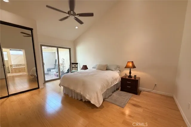 a spacious bedroom with a bed and a table