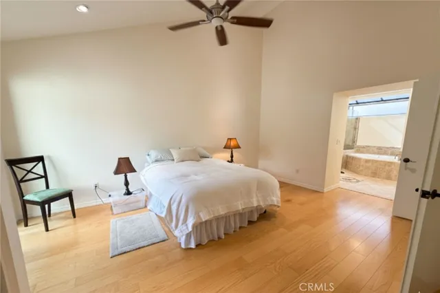 a bedroom with a bed and a table